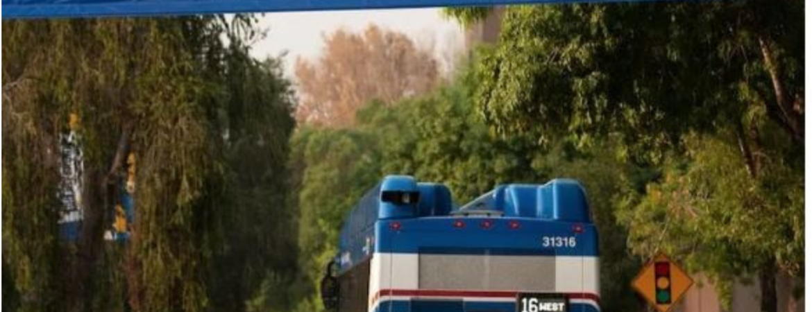 26-27 Web Article Image of RTA Bus with Welcome to UCR Banner